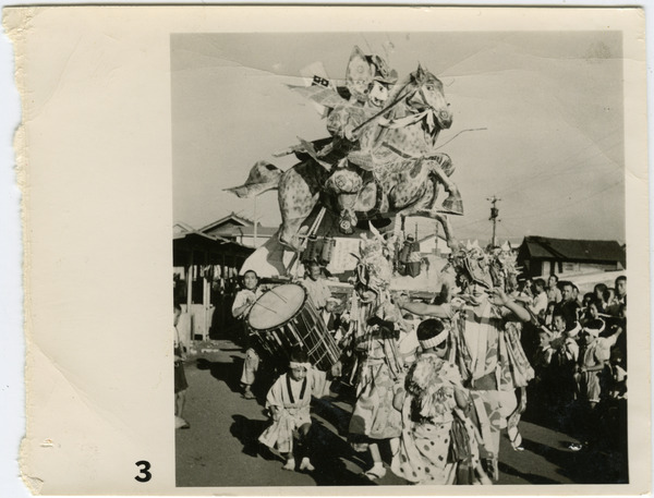 Elaborate float depicting a samurai on horseback in a matsuri procession, ca. 1950